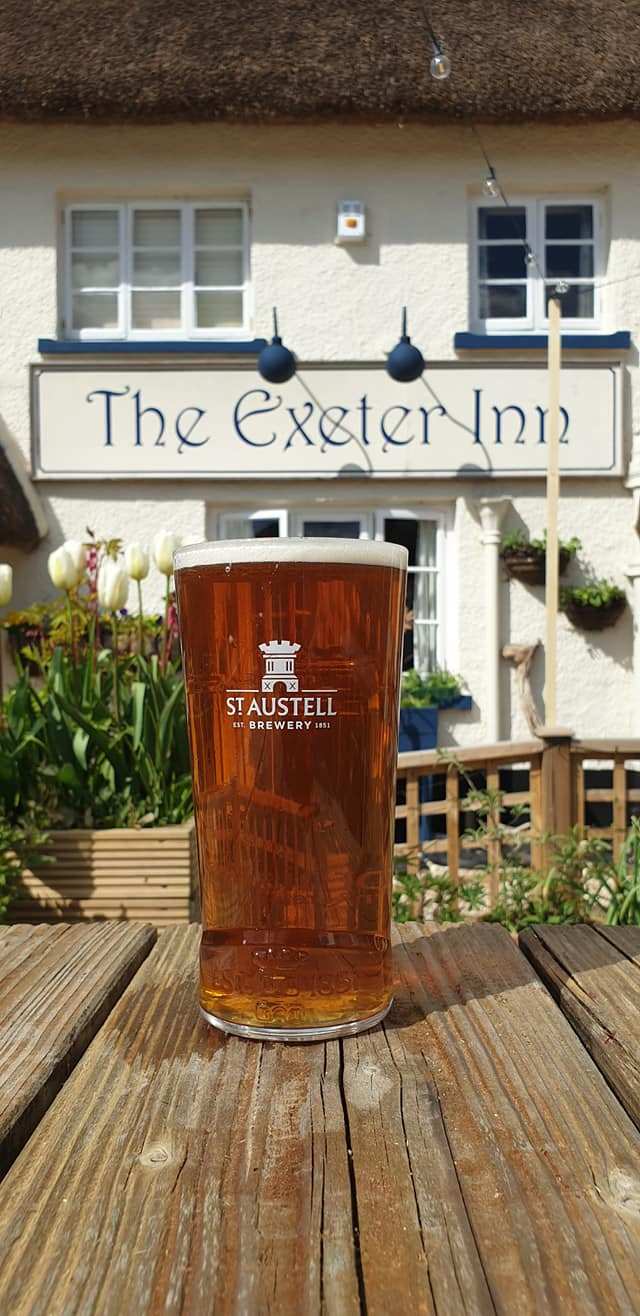 a glass of beer on a table