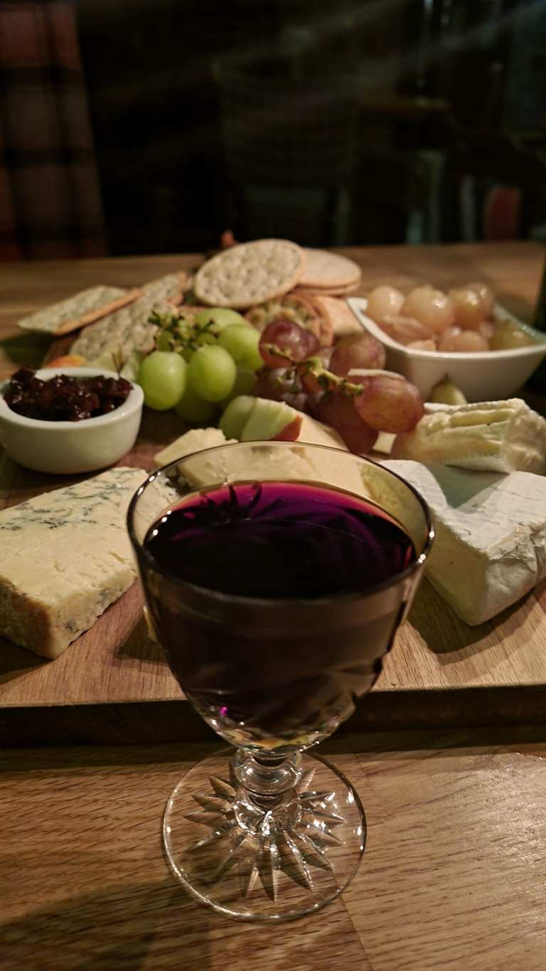 a glass of wine on a table